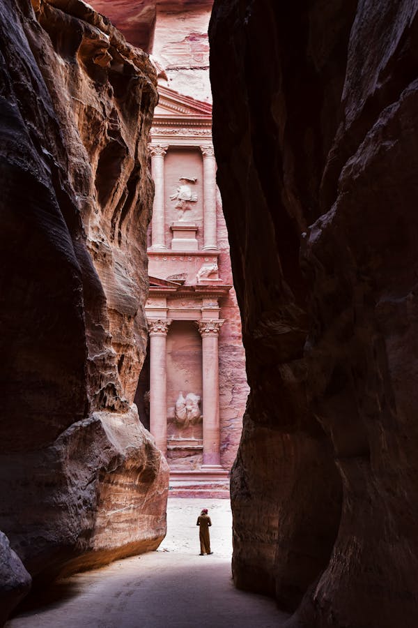 free-photo-of-columns-of-the-treasury-in-petra-behind-rocks