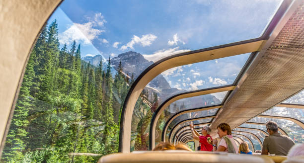 Vancouver, British Columbia / Canada - 06/17/2015 Rocky Mountaineer train traveling through the Rocky Mountains with luxury dining on board.