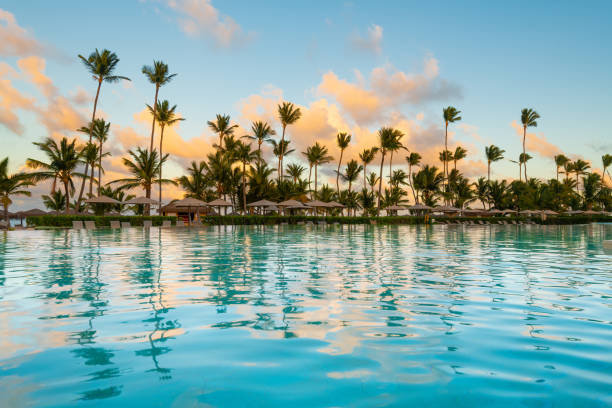 Swimming pool and palm trees in luxury resort at Pun Cana in the Dominican Republic