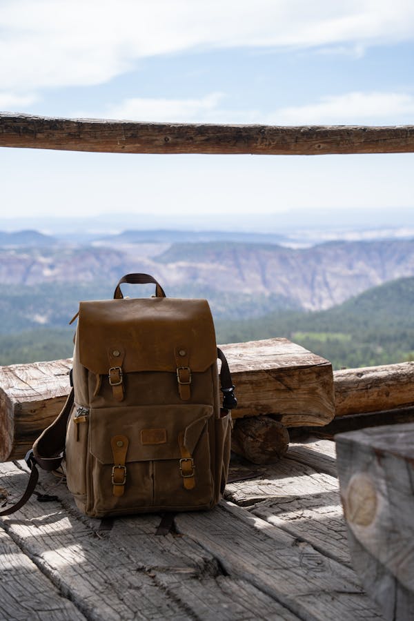 free-photo-of-brown-leather-backpack-on-a-wooden-observation-tower